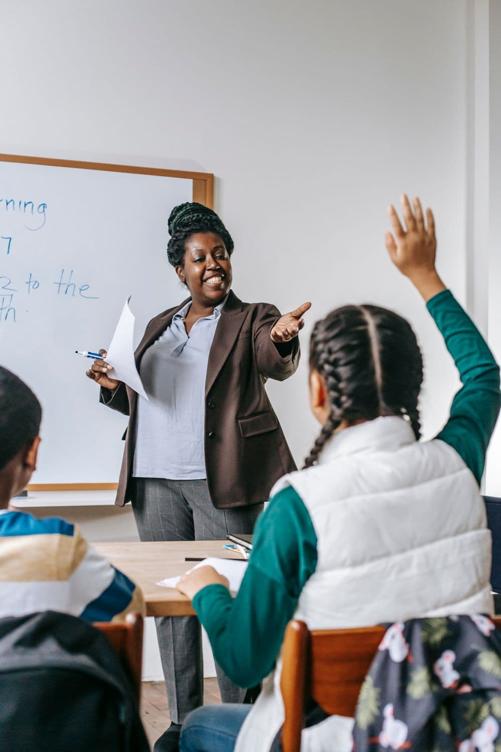 A teacher guiding a classroom discussion